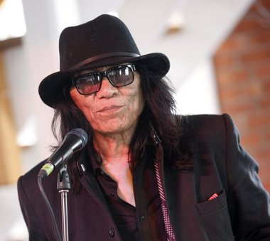 Searching for Sugar Man" star Rodriguez appears to be staying put in Detroit - even if he wins an Oscar next month.  Associated Press